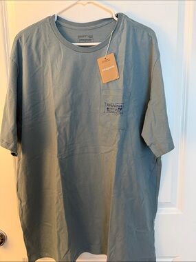 Men’s XXL Patagonia Hawaii T with front left pocket and Hawaiian aloha on back.